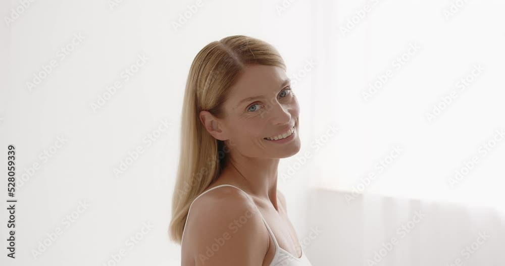 Senior positive lady close up portrait. Beautiful gorgeous 50s mid aged mature woman Senior positive lady close up portrait. Beautiful gorgeous 50s mid aged mature woman