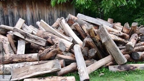 A view of a pile of wood cut and arranged for heating for the winter. photo