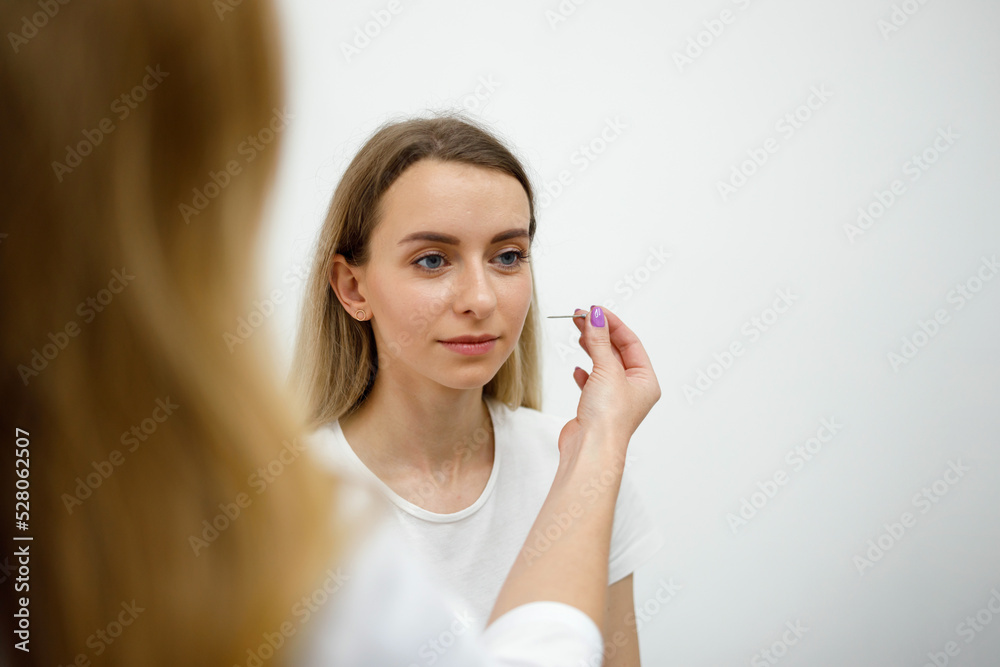 Professional neurologist doctor examining the body reflexion. The doctor checks the patient reflex with needle tool. Diagnosis of neurological diseases Professional neurologist doctor examining the body reflexion. The doctor checks the patient reflex with needle tool. Diagnosis of neurological diseases