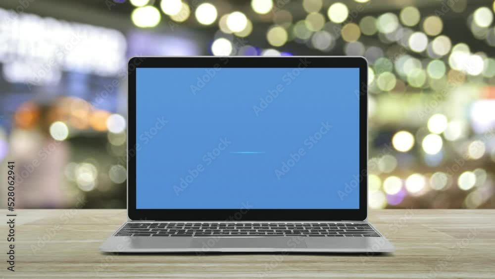 Law flat icon on modern laptop computer monitor screen on wooden table over blur light and shadow of shopping mall, Business legal service online concept Law flat icon on modern laptop computer monitor screen on wooden table over blur light and shadow of shopping mall, Business legal service online concept