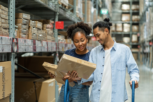 Asian couple and an African American wife shop at shoppinf, pick up boxes on the shelves, check prices in wholesale stores. self service concept