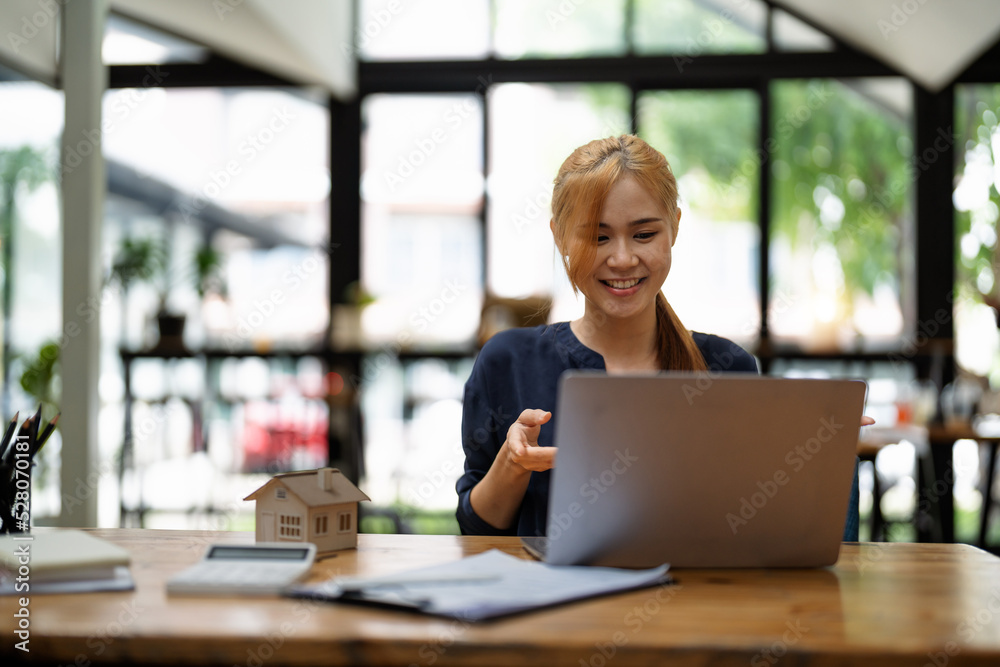 Real estate agent on video call in modern office Real estate agent on video call in modern office
