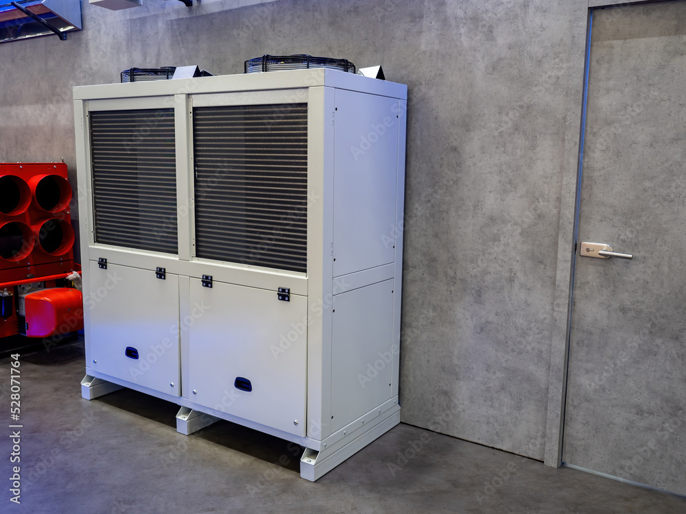 Industrial air conditioner. Climate technology. Precision air conditioner.  Climatic equipment for industrial premises. Precision air conditioner near  gray wall. Sale of climatic equipment concept Stock Photo | Adobe Stock