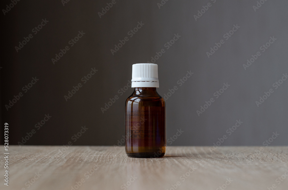 Glass jar with plastic lid. Dark glass jar. Medicine container. Pharmaceutical glassware. Chemical vessels. Glass jar with plastic lid. Dark glass jar. Medicine container. Pharmaceutical glassware. Chemical vessels.