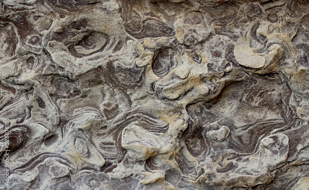 Closeup of the weathered surface of a sandstone building block in Dunfermline Abbey