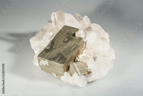 A sample of a natural mineral crystal iron pyrite (sulfide class) fusion on quartz druze untreated crystalline pyrite, fool's gold. Museum Mineral Series. Mineralogical sample