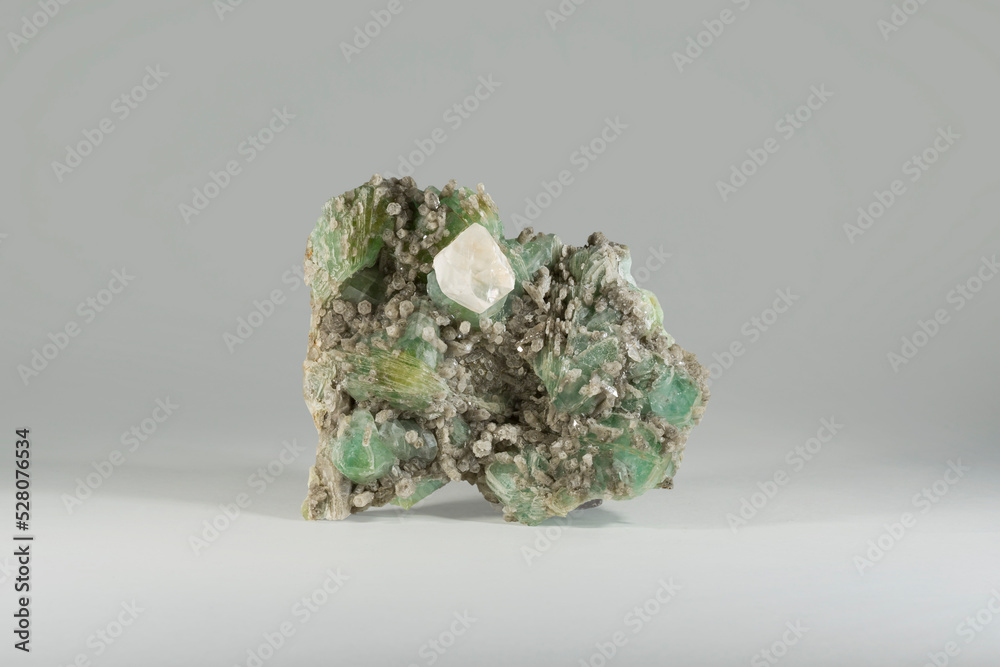 A sample of a natural mineral Calcite (carbonate class) quartz on a druse of green datolite crossed with papirspat. Museum Mineral Series. Mineralogical sample
