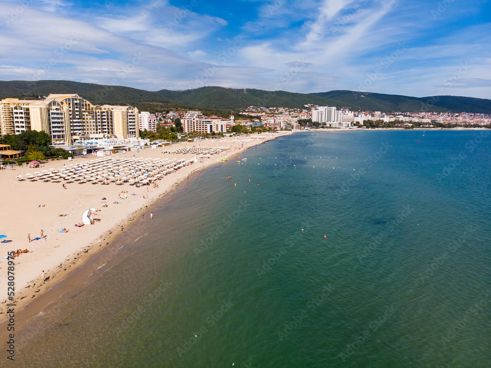 Aerial panoramic view of Sunny Beach area of Bulgaria, sand beach, sunbeds and sun umbrellas. Drone view from above. Summer holidays destination