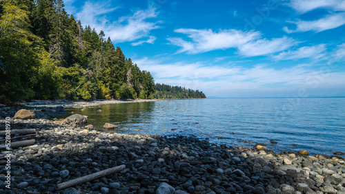 Tranquil Vancouver Island rocky beach seascape of Strait of Georgia near Campbell River, British Columbia, Canada 