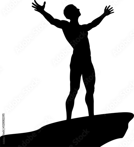 Man on cliff top with arms ...