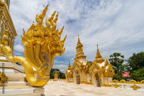 Nakhon Phanom, Thailand, July 31, 2022. The Naga at Wat Marukkha Nakhon has a chedi shaped like Phra That Phanom. Nakhon Phanom Province, Thailand photo