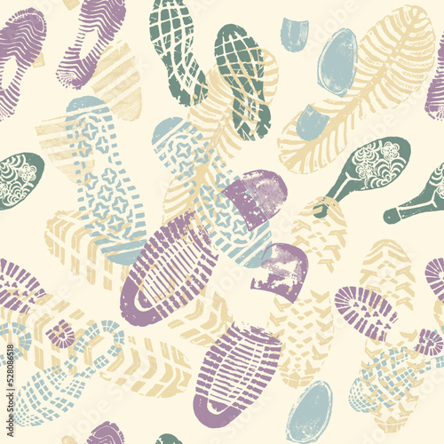 Vector seamless pattern double footprints on pale yellow background