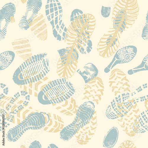 Vector seamless pattern blue and yellow double footprints on pale yellow background