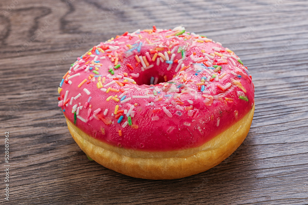 Sweet glazed struwberry donut with icing Sweet glazed struwberry donut with icing