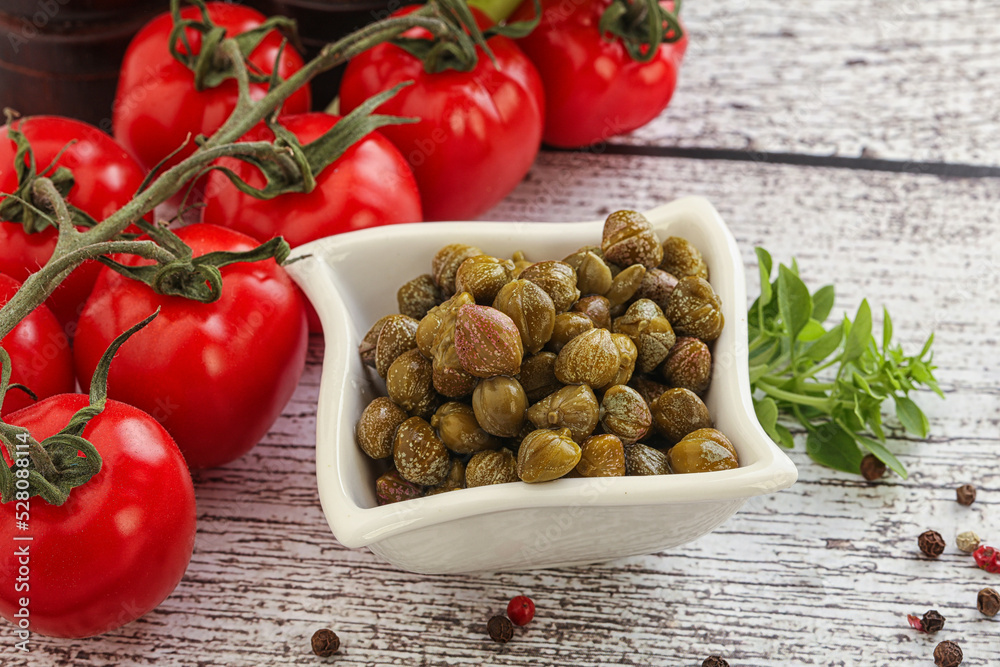 Marinated green capers in the bowl Marinated green capers in the bowl