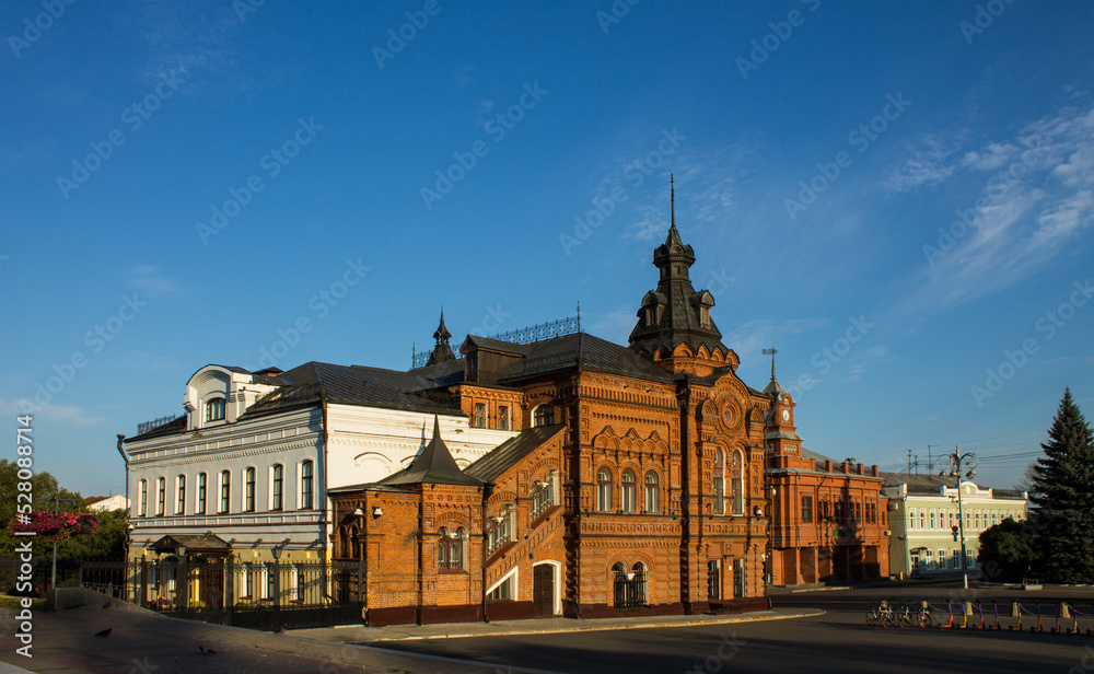 VLADIMIR, RUSSIA - AUGUST, 17, 2022: the historic brick facade of the Friendship House and the City Duma building in the old town on a sunny summer day