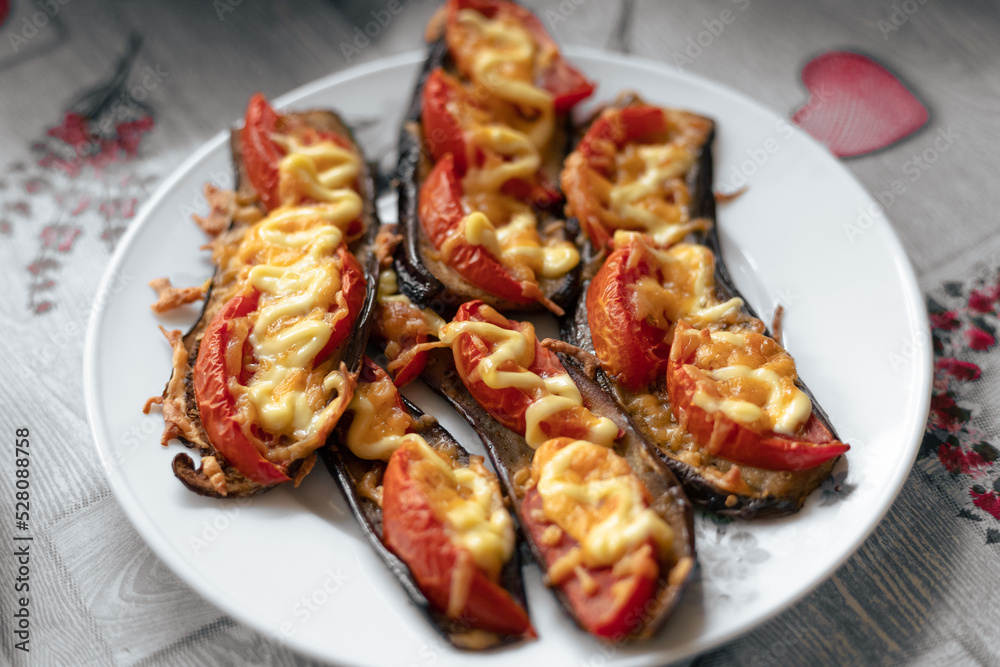 Fried eggplant with tomatoes and cheese. Georgian eggplant Fried eggplant with tomatoes and cheese. Georgian eggplant