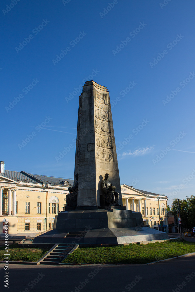 VLADIMIR, RUSSIA - AUGUST, 17, 2022: Cathedral Square in the old town with a stele with bronze statues on a sunny summer day