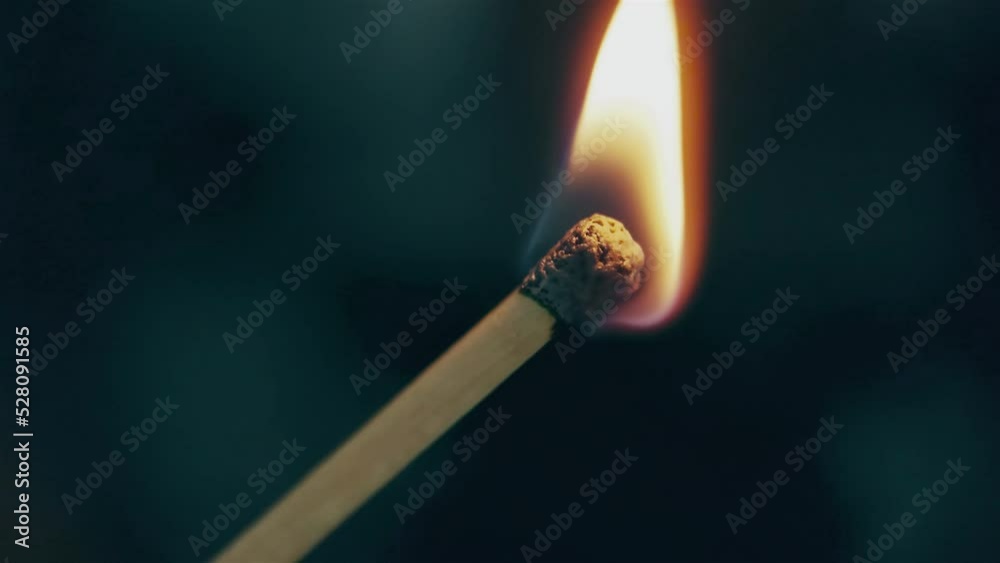 Macro shooting of a burning match head Macro shooting of a burning match head