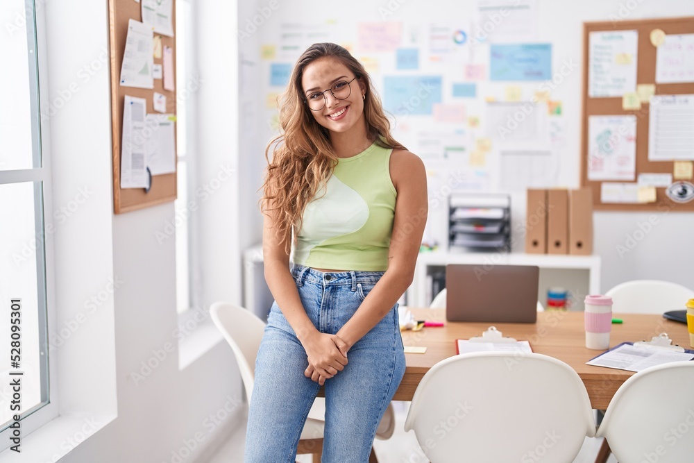 Young beautiful hispanic woman business worker smiling confident at office Young beautiful hispanic woman business worker smiling confident at office
