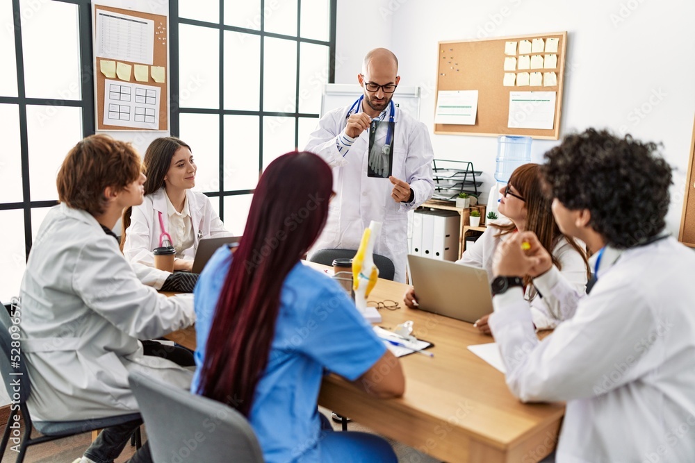 Group of young doctor discussing in a medical meeting at the clinic office. Group of young doctor discussing in a medical meeting at the clinic office.