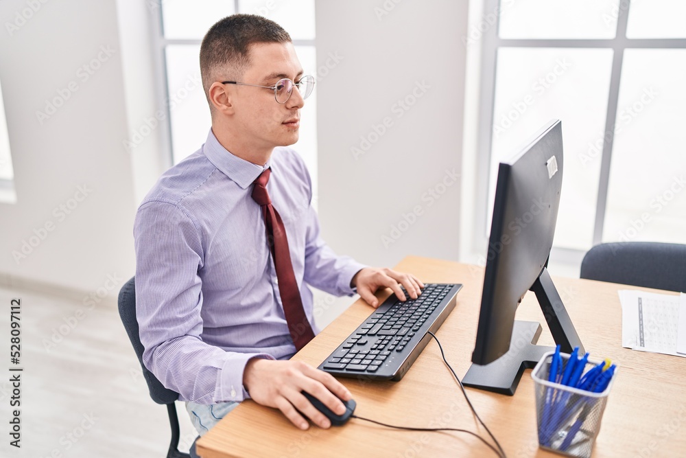 Young hispanic man business worker using computer working at office Young hispanic man business worker using computer working at office