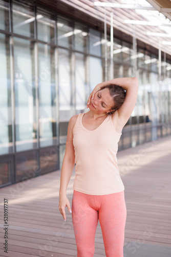 Beautiful strong muscular woman doing stretching on mat on terrace outdoors. Healthy young adult girl in sportswear stretch alone. Fit thin gimnast doing yoga and pilates, training on mat. Perspective Free Download Beautiful strong muscular woman doing stretching on mat on terrace outdoors. Healthy young adult girl in sportswear stretch alone. Fit thin gimnast doing yoga and pilates, training on mat. Perspective - GFXLoad