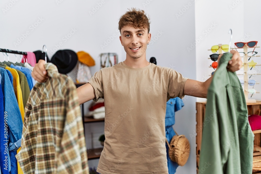 Young caucasian man smiling confident shopping at clothing store Young caucasian man smiling confident shopping at clothing store