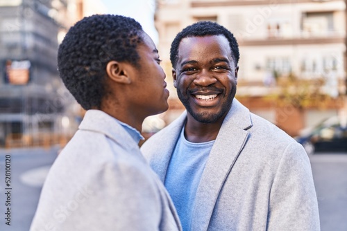 Man and woman couple smiling confident standing together at street