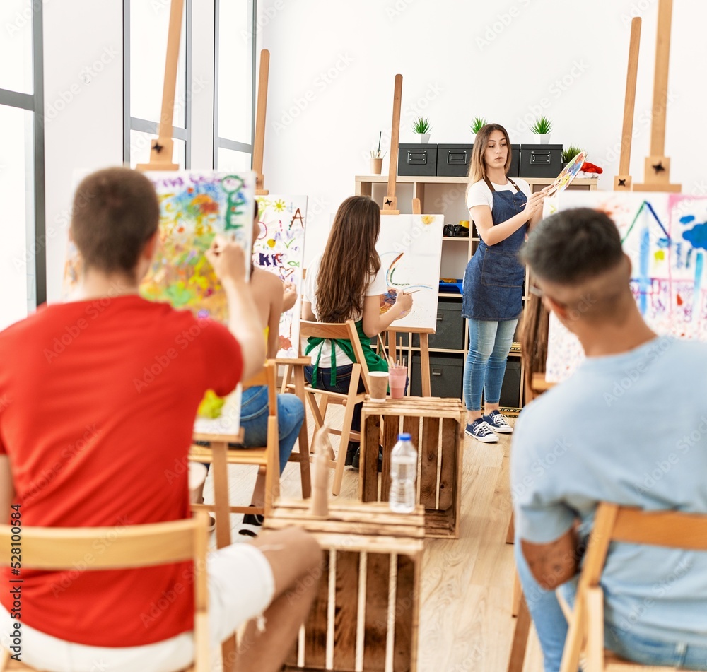 Group of people having paint lesson at art studio. Group of people having paint lesson at art studio.