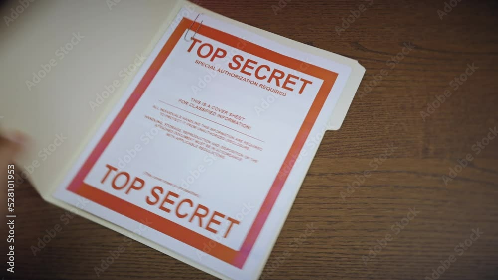 A folder containing a United States Top Secret document gets taken. A folder containing a United States Top Secret document gets taken.