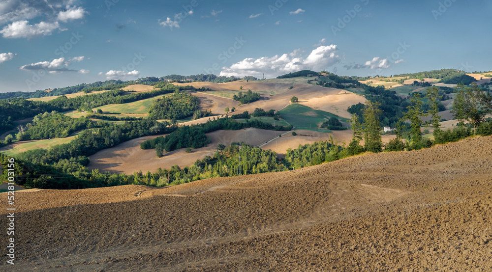 Clouds shadows on the cultivated rolling hills, Loiano, Bologna province, Emilia-Romagna, Italy Clouds shadows on the cultivated rolling hills, Loiano, Bologna province, Emilia-Romagna, Italy