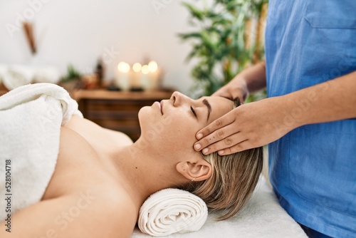 Woman couple having facial massage at beauty center photo