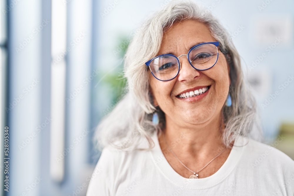 Middle age woman smiling confident standing at home Middle age woman smiling confident standing at home