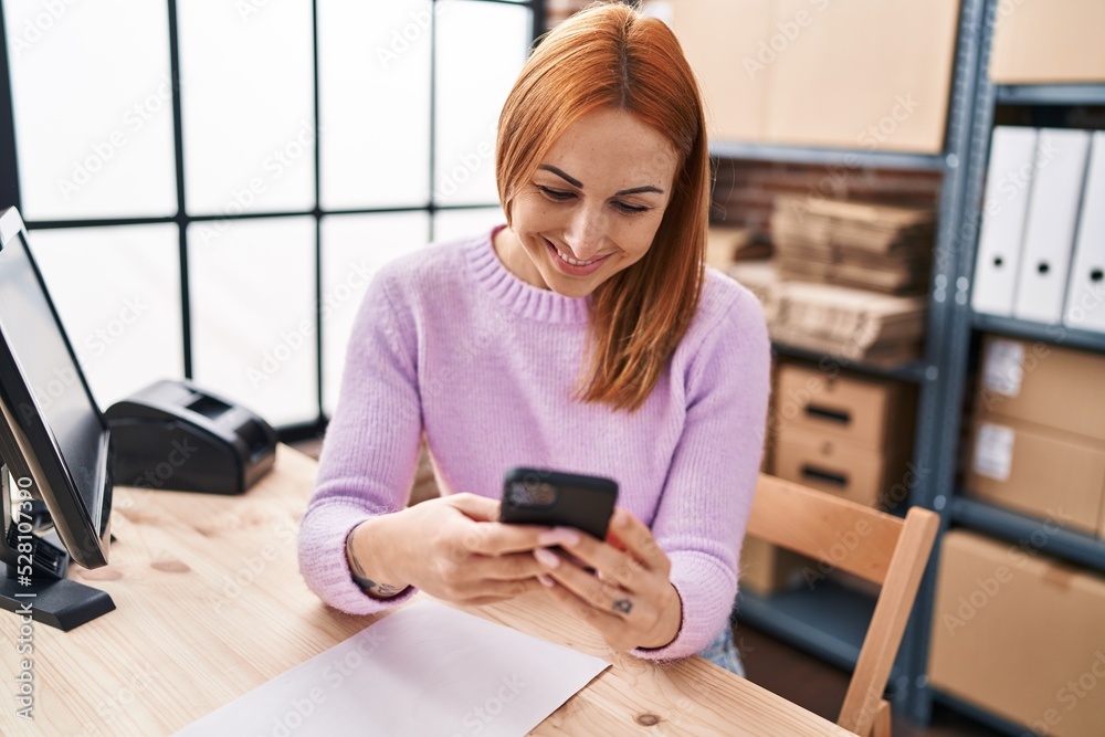 Young caucasian woman ecommerce business worker using smartphone at office Young caucasian woman ecommerce business worker using smartphone at office