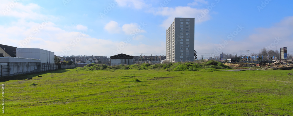New apartement building tower in front of wasteland in a recently developping area in Talca, Chile New apartement building tower in front of wasteland in a recently developping area in Talca, Chile