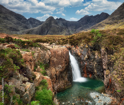 Fototapeta Naklejka Na Ścianę i Meble -  Isle of Skye - Fairy pool waterfall in Scotland, UK