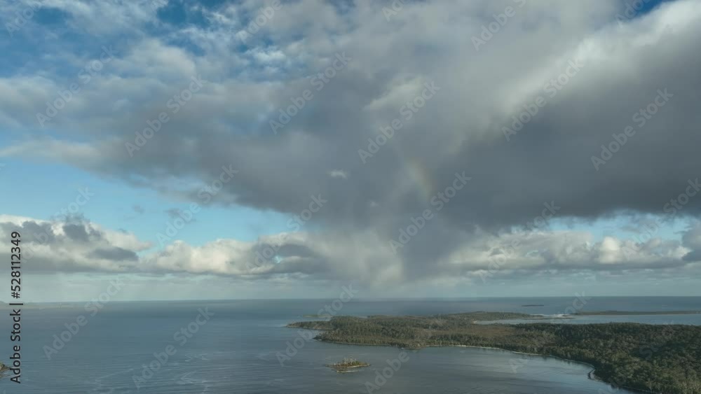 top down view of a beach holiday town on the coastline surrounded by forest top down view of a beach holiday town on the coastline surrounded by forest