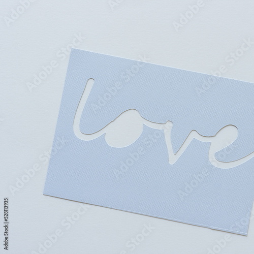the word love represented with paper (simple card) photo