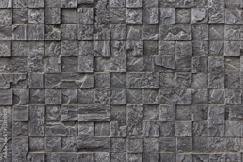 artificial stone wall, plastic panel imitating small cuboid wall brickwork mosaic photo