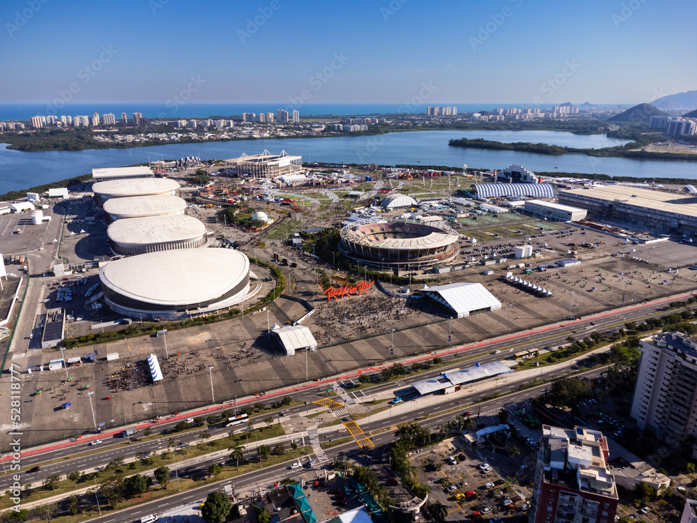 Naklejka premium Aerial view of the Rock in Rio 2022 music festival at Barra da Tijuca Olympic Park in Rio de Janeiro. Jacarépaguá Lagoon and surrounding buildings. Rio de janeiro Brazil. September 2022. Drone photo.