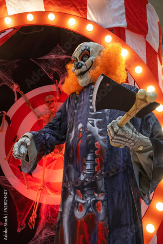 Portrait of bad bloody clown with orange hair. Horror Clown. Blood freak.