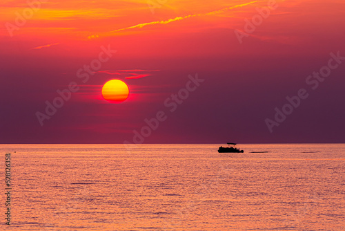 Fototapeta Naklejka Na Ścianę i Meble -  Boat in the sunset. 