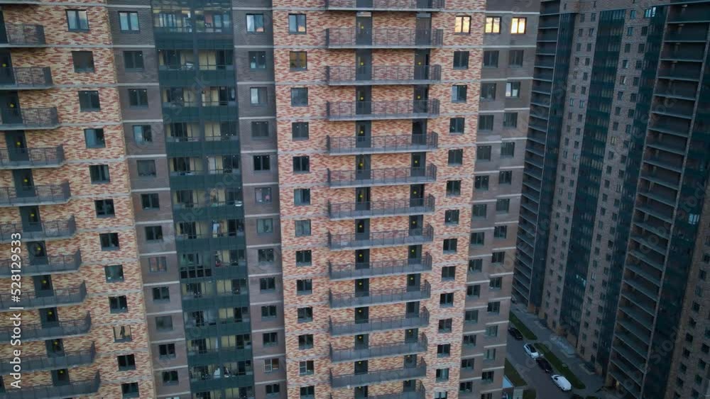 Aerial side, around view of a residential high-rise buildings and constructing more next to park and highway in the historical and at same time modern city of St. Petersburg at sunny summer evening Aerial side, around view of a residential high-rise buildings and constructing more next to park and highway in the historical and at same time modern city of St. Petersburg at sunny summer evening