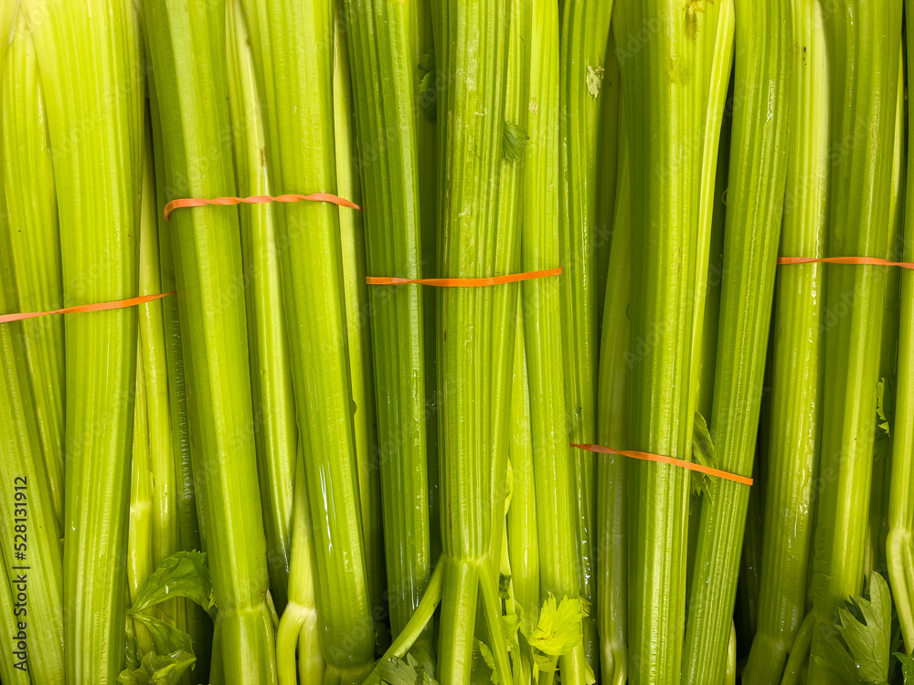 Fototapeta premium Organic Fresh Leeks on display at supermarket