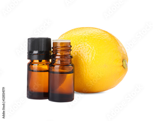 Fototapeta Naklejka Na Ścianę i Meble -  Bottles of citrus essential oil and fresh lemon isolated on white