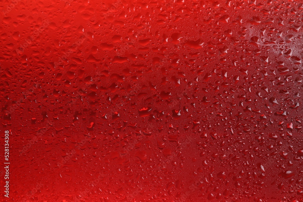 Glass of tasty cold beer with condensation drops as background, closeup Glass of tasty cold beer with condensation drops as background, closeup