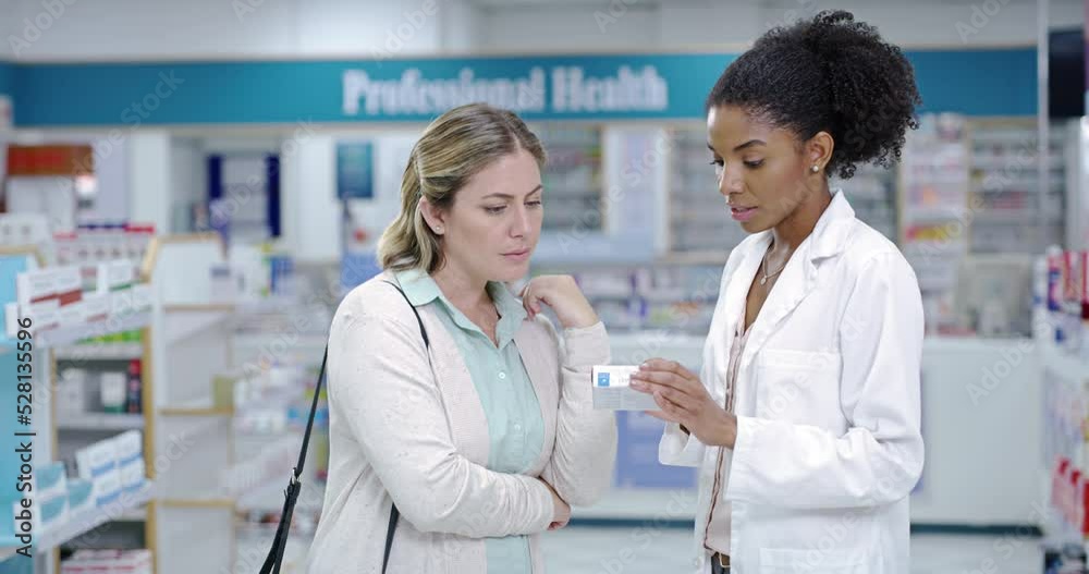 Doctor or pharmacist consulting customer or patient with medicine and professional advice at a pharmacy. Medical expert with great customer service, pills and health care treatment to woman in store Doctor or pharmacist consulting customer or patient with medicine and professional advice at a pharmacy. Medical expert with great customer service, pills and health care treatment to woman in store