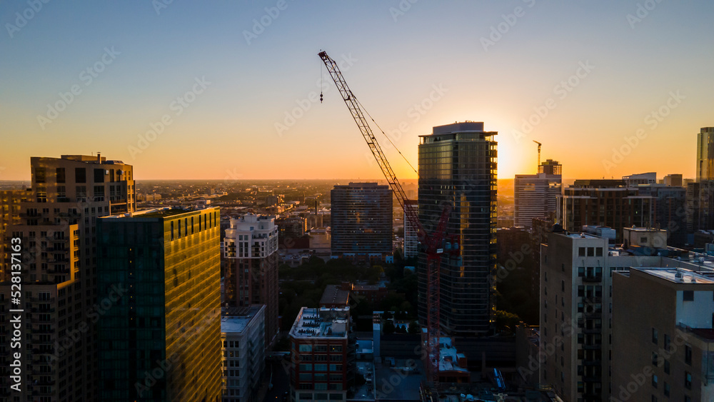 Chicago, IL USA September 1 2022: establishing aerial drone footage of Chicago downtown during sunset on a mid summer evening. the contemporary buildings are beautiful to watch for tourist  