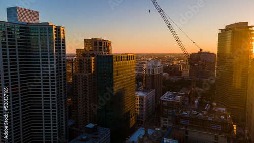 Chicago  IL USA September 1 2022  establishing aerial drone footage of Chicago downtown during sunset on a mid summer evening. the contemporary buildings are beautiful to watch for tourist  
